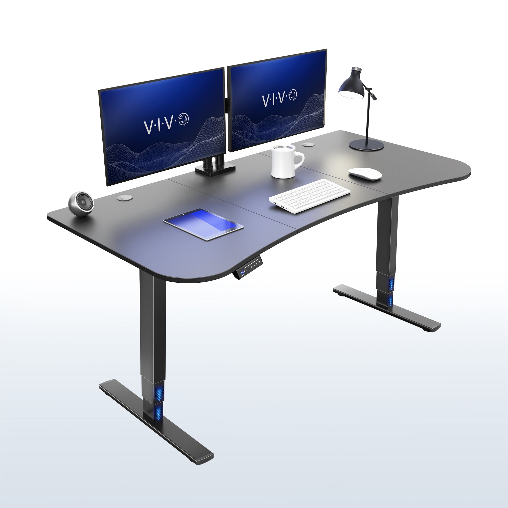 A modern curved standing desk with black top and black metal legs, shown with two dual-monitor setups, a desk lamp, a keyboard, a mouse, a mug, and a tablet on a clean white-to-light-gray background.