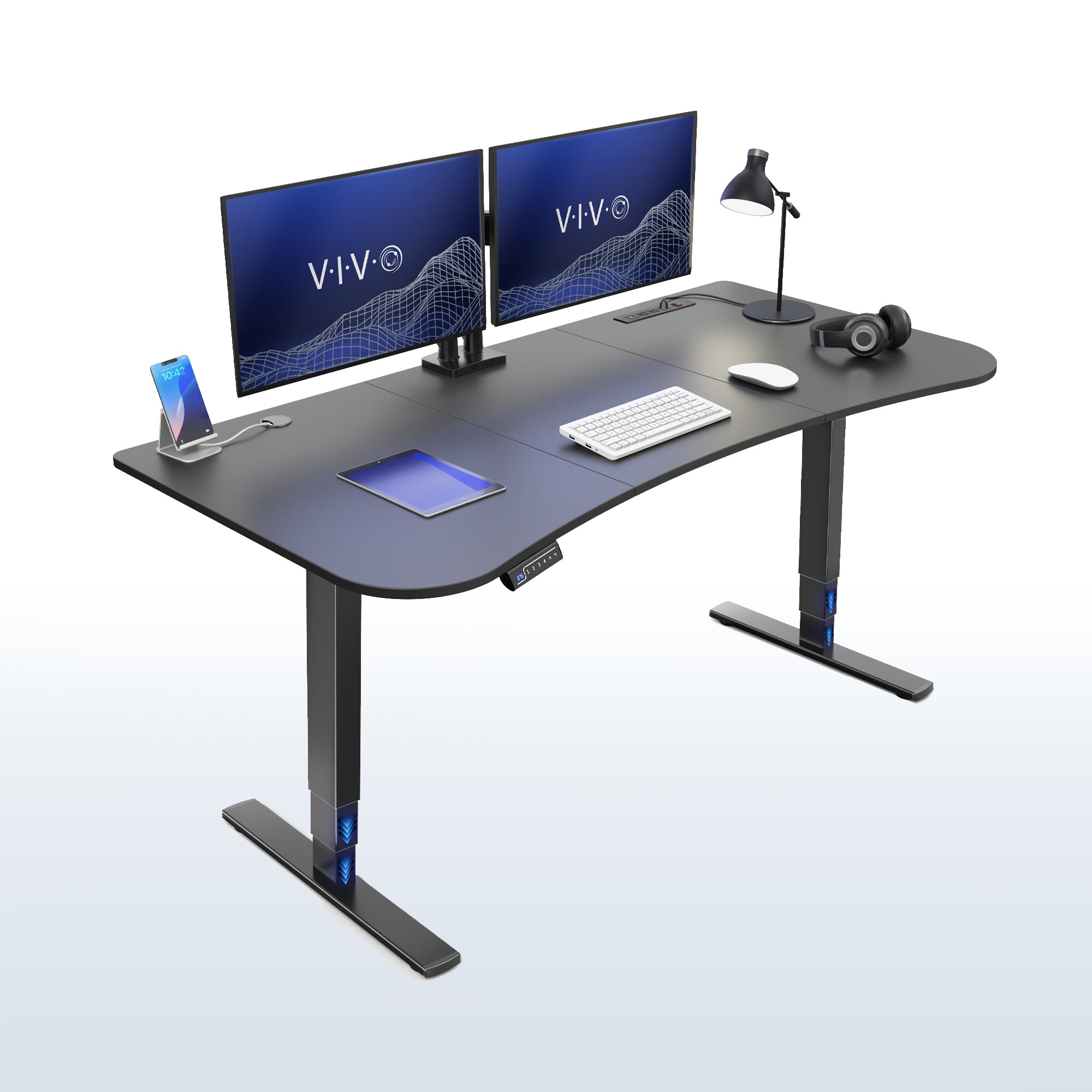 63” x 32” Electric Height Adjustable Stand Up Desk. Features a built-in power strip.
