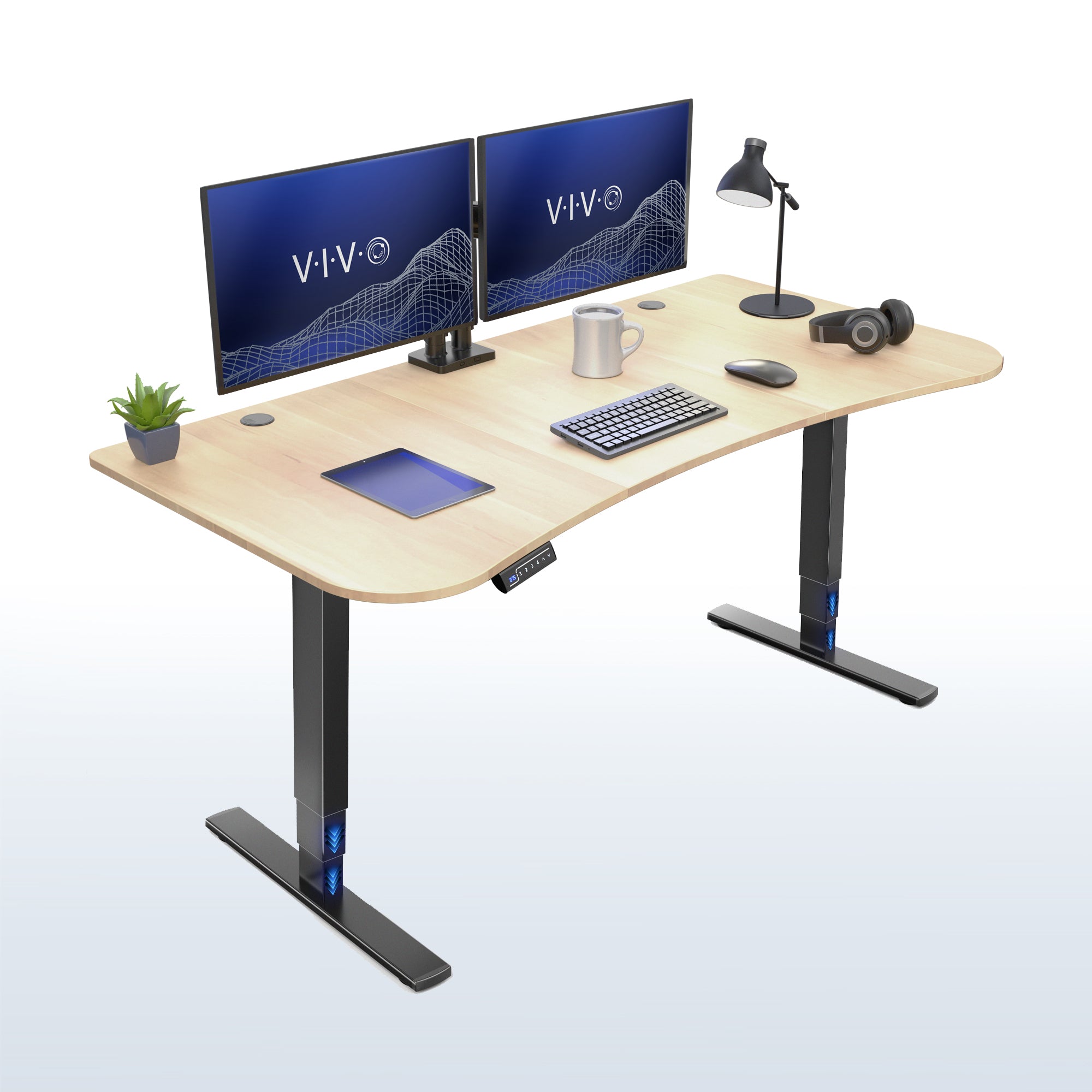 63” x 32” Electric Height Adjustable Stand Up Desk. Features a built-in power strip.