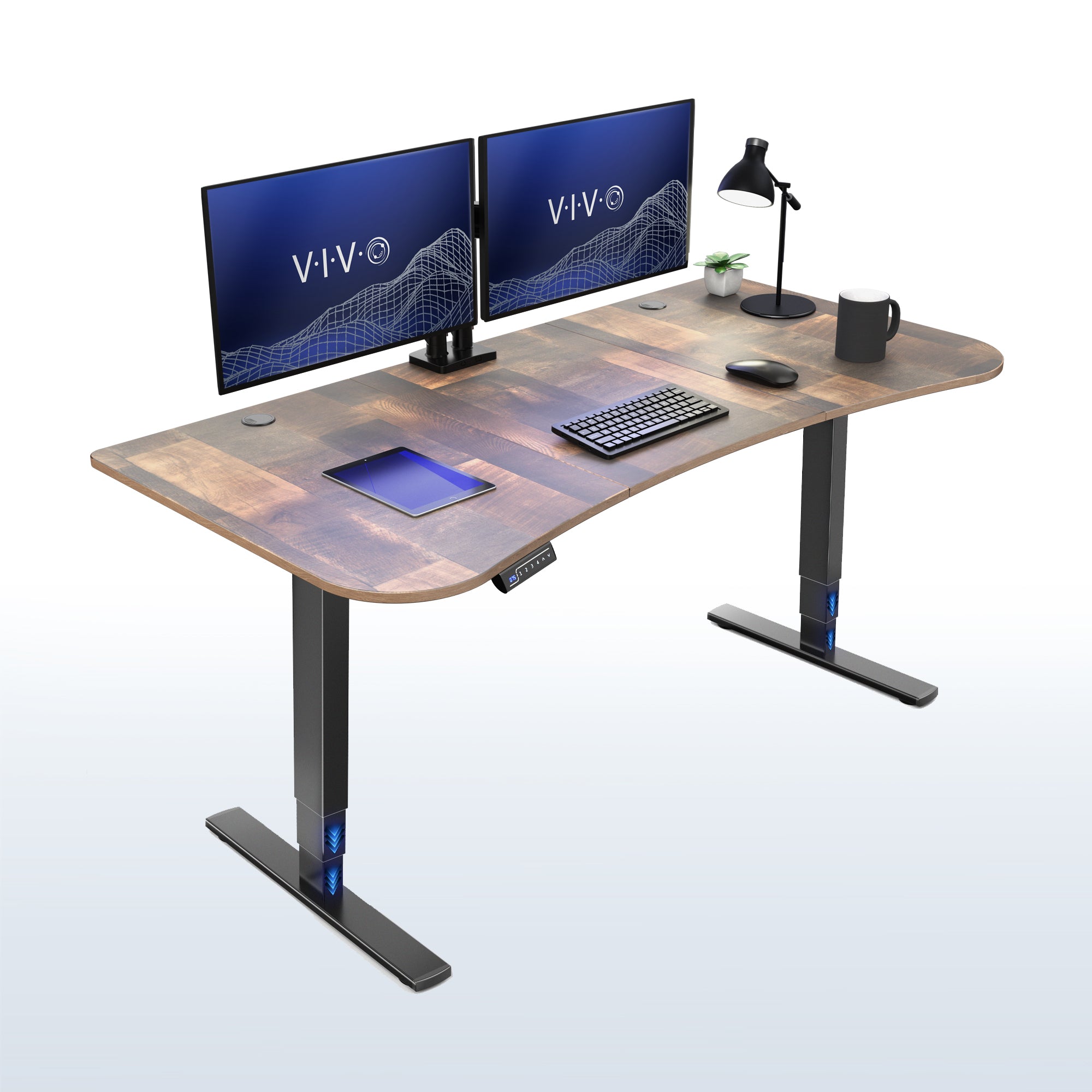 63” x 32” Electric Height Adjustable Stand Up Desk. Features a built-in power strip.