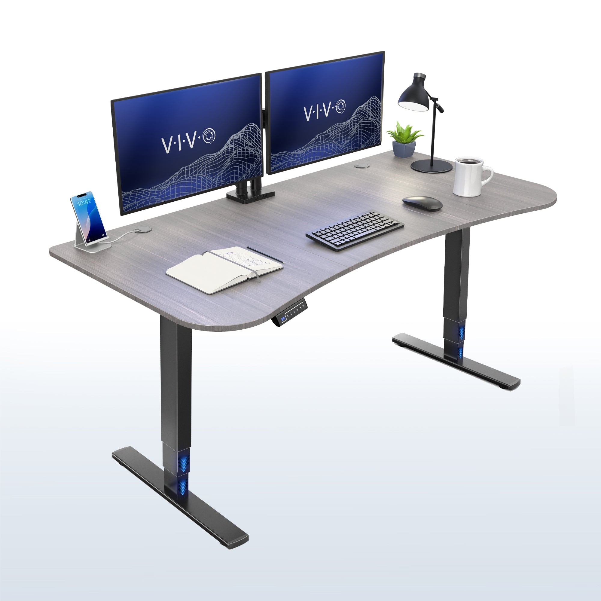 63” x 32” Electric Height Adjustable Stand Up Desk. Features a built-in power strip.
