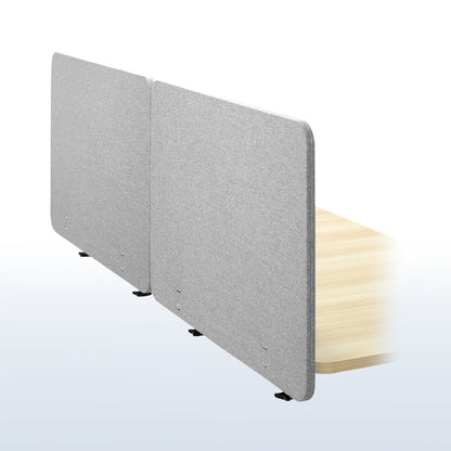 Clamp-on desk privacy panel for office workspace.