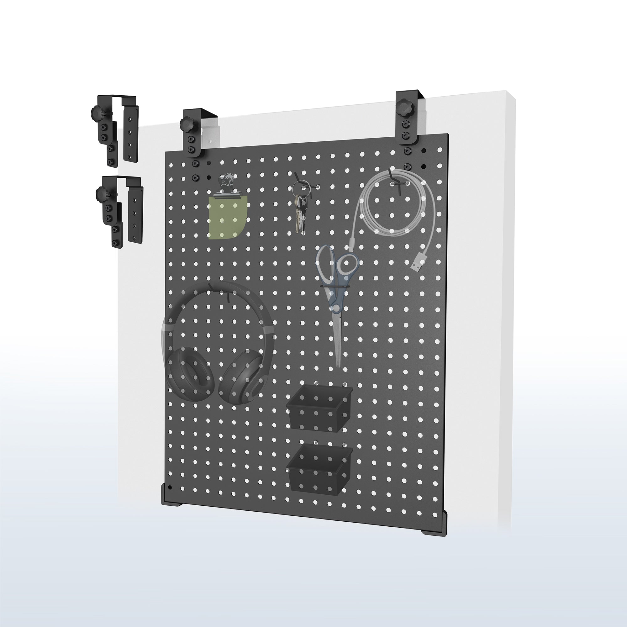 A black pegboard with various tools and equipment hanging on it, mounted on a white wall.