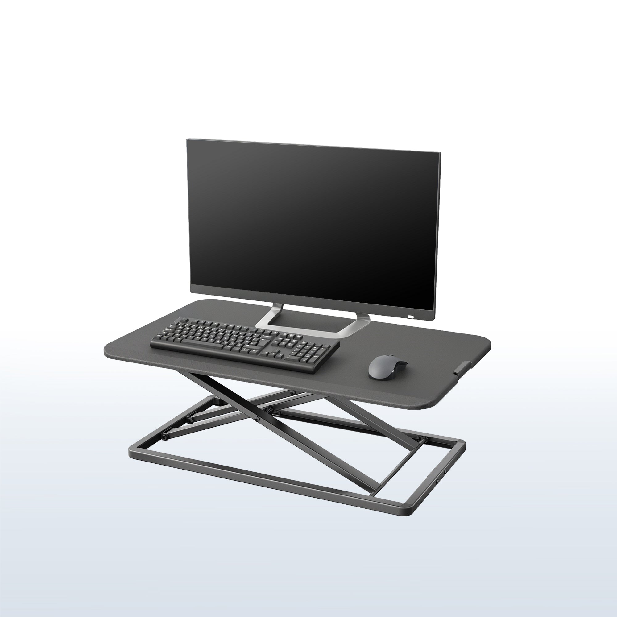 Black heavy-duty height adjustable desk converter monitor riser.