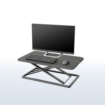 Black heavy-duty height adjustable desk converter monitor riser.