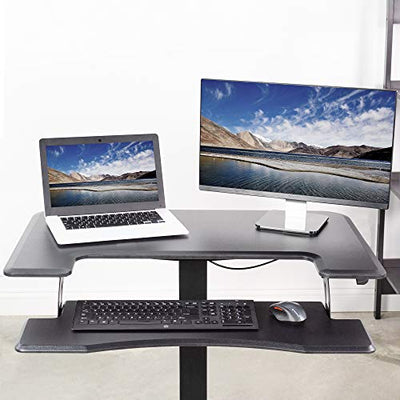 Two-tier desktop podium with a monitor, laptop, keyboard, and mouse.