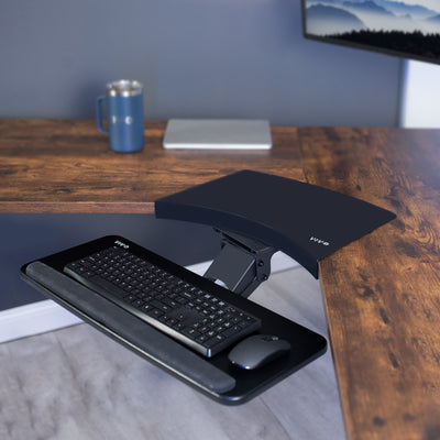 Extended black Keyboard tray mounted to the corner desk connector.