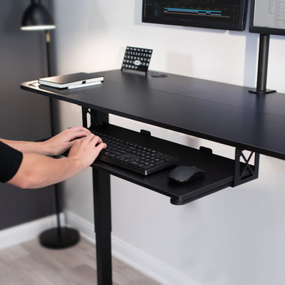 Minimalist modern office workspace with ergonomic typing and viewing angles.