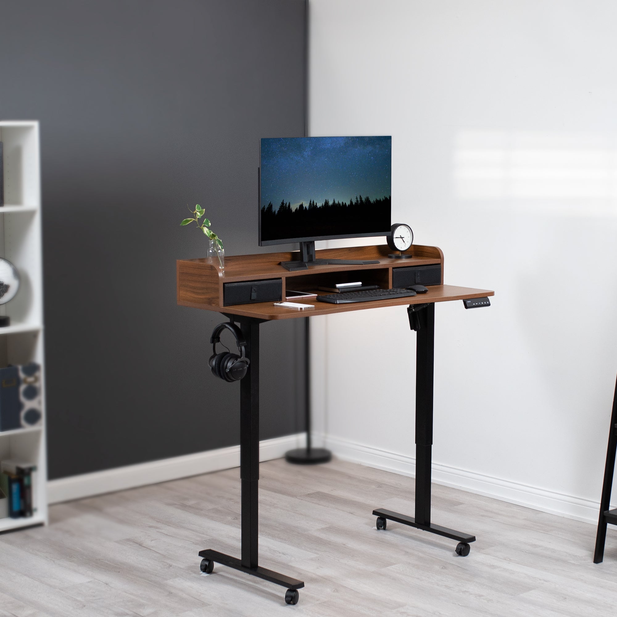 Dual tier height adjustable mobile electric desk with storage drawers.