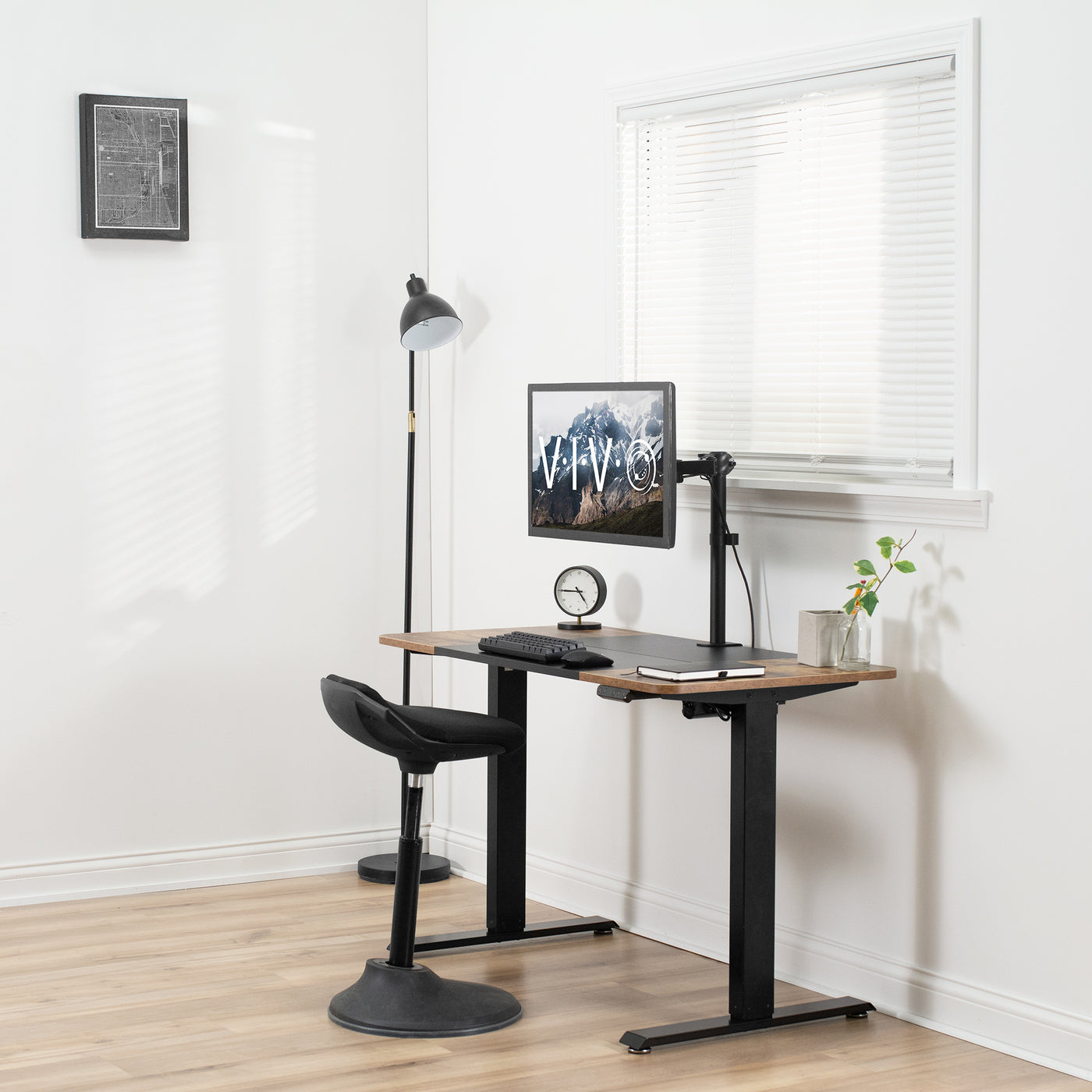Sturdy rustic electric sit or stand desk workstation with adjustable height.