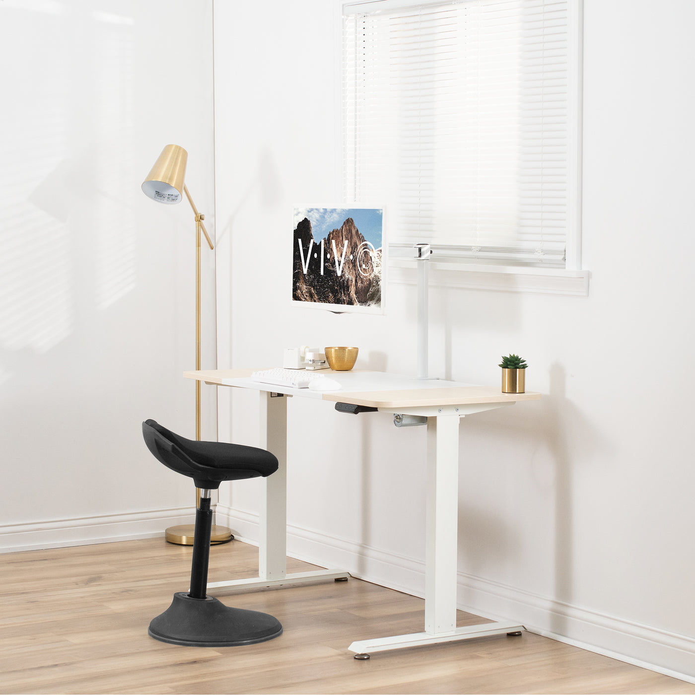 Sturdy electric sit or stand desk workstation with adjustable height.