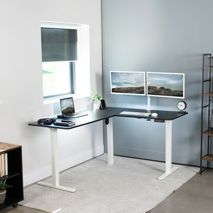 Electric heavy-duty corner desk workstation for modern office workspaces. 