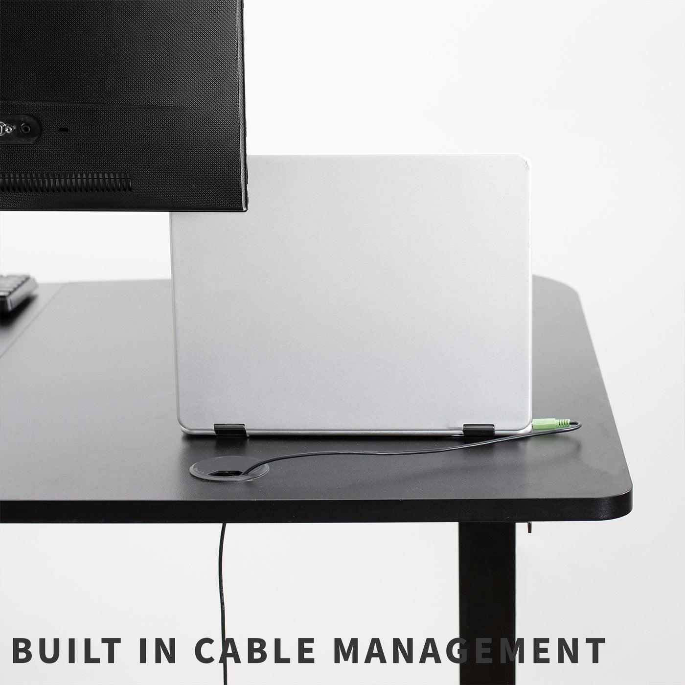 Sturdy manual hand crank height adjustable desk for sit or stand workstation with built-in cable management.
