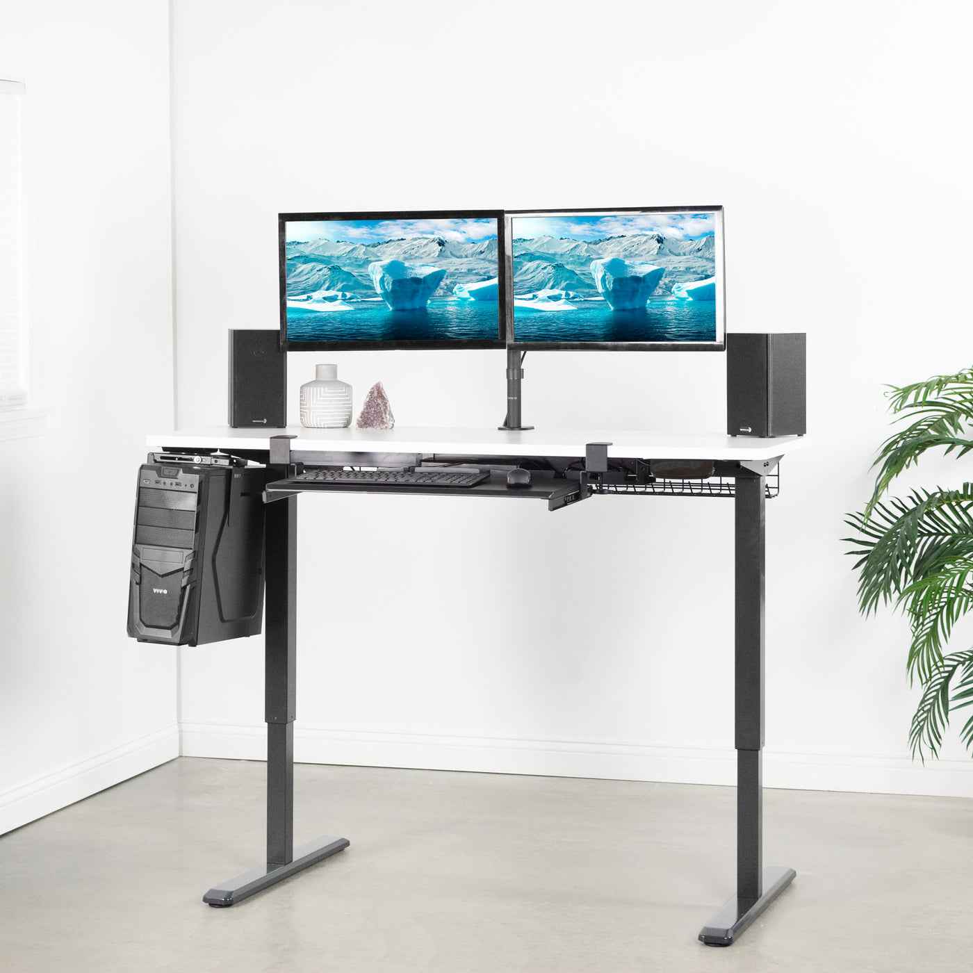 Heavy-duty electric height adjustable desktop workstation for active sit or stand efficient workspace.