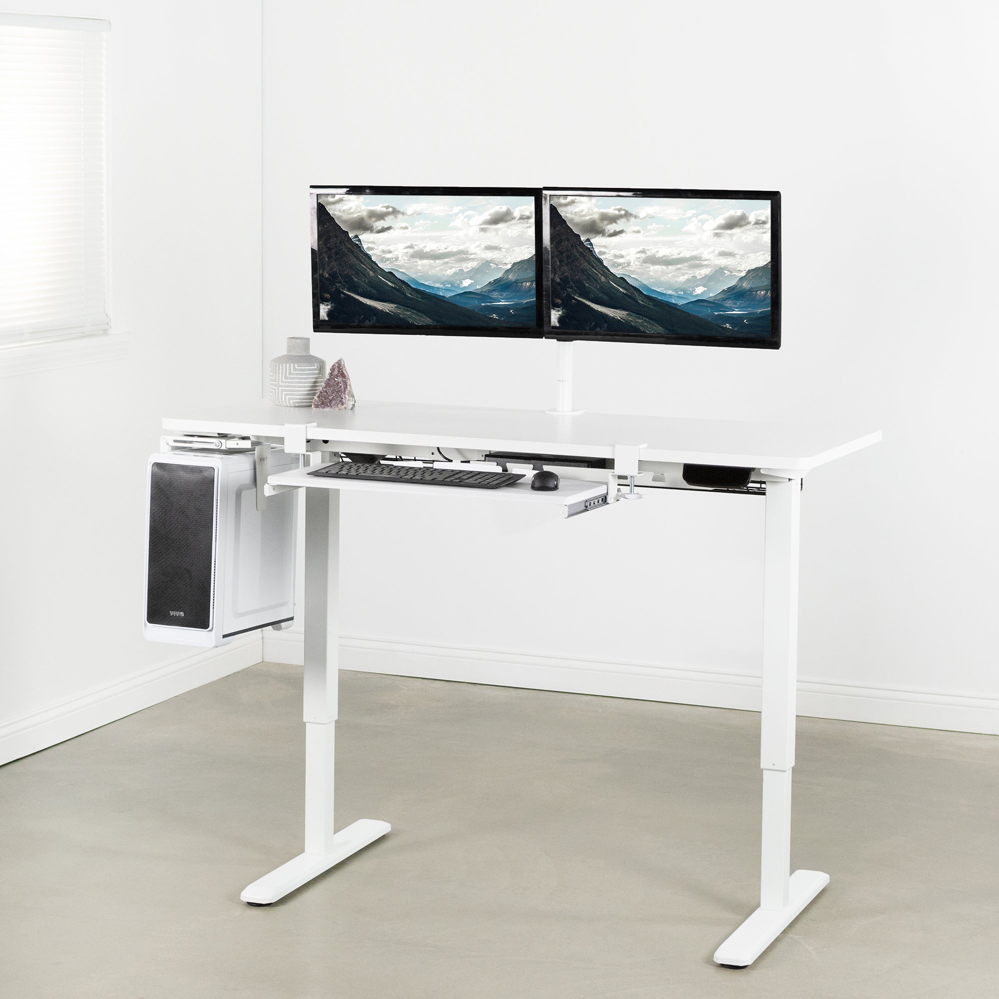 Heavy-duty electric height adjustable desktop workstation for active sit or stand efficient workspace.