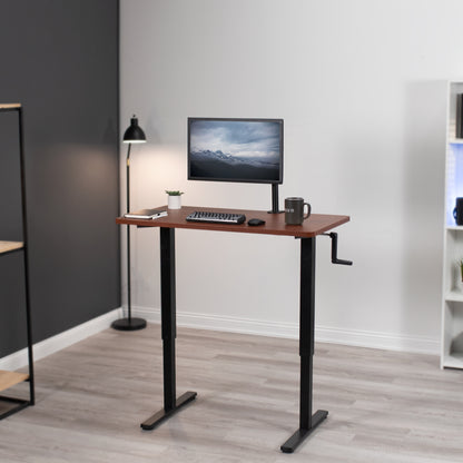 Manual hand crank height adjustable desk for active sit to stand workstation.