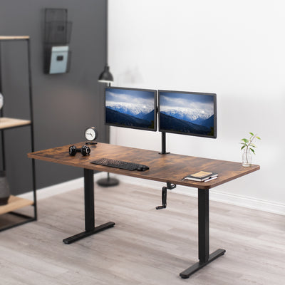 Rustic wide surface sturdy sit or stand active workstation with adjustable height using manual hand crank.