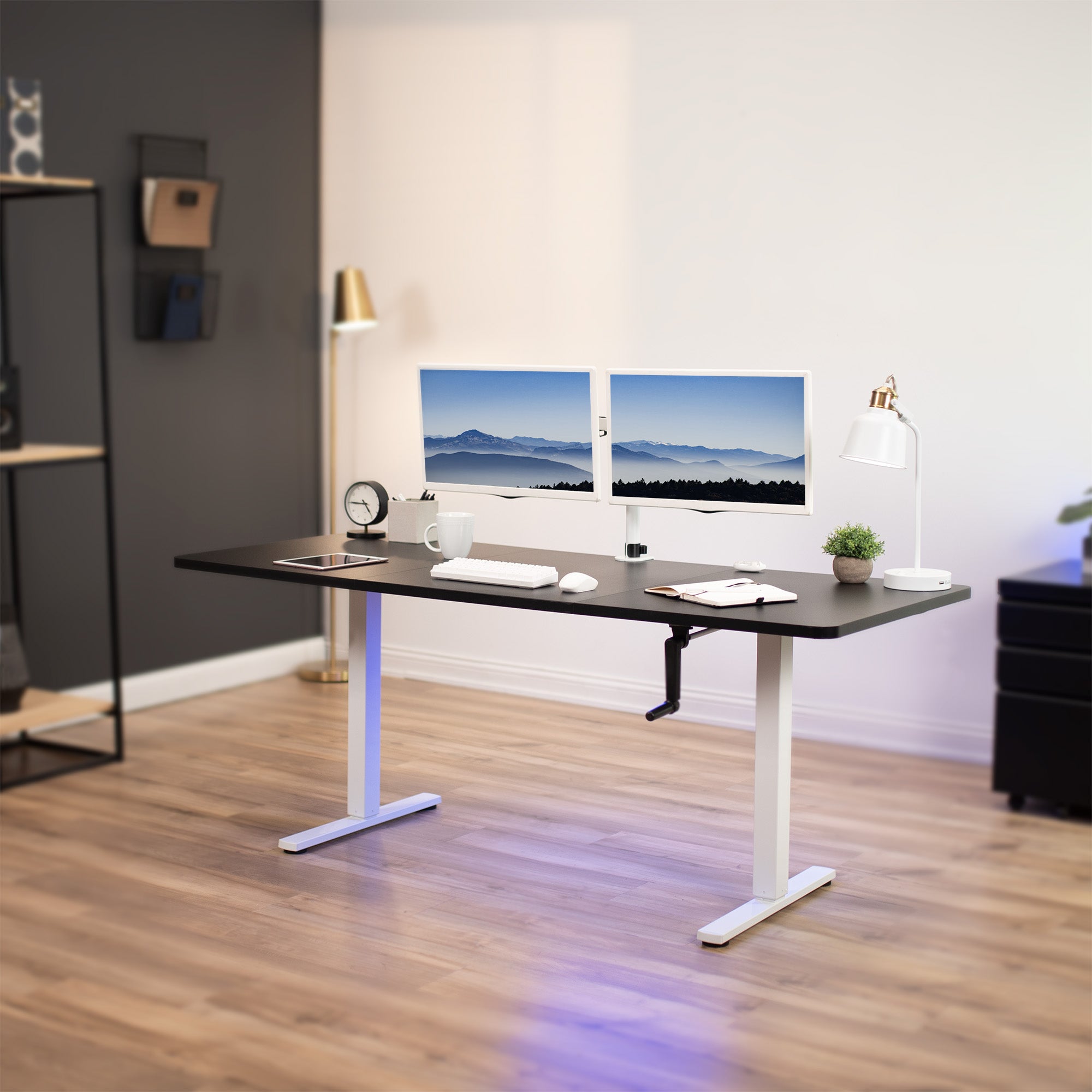 Wide surface sturdy sit or stand active workstation with adjustable height using manual hand crank.