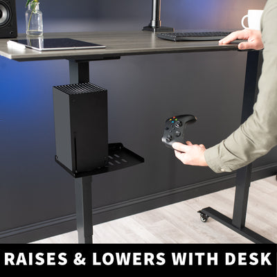 Under desk clamp on leg tray holding discretion out of sight and out of mind.