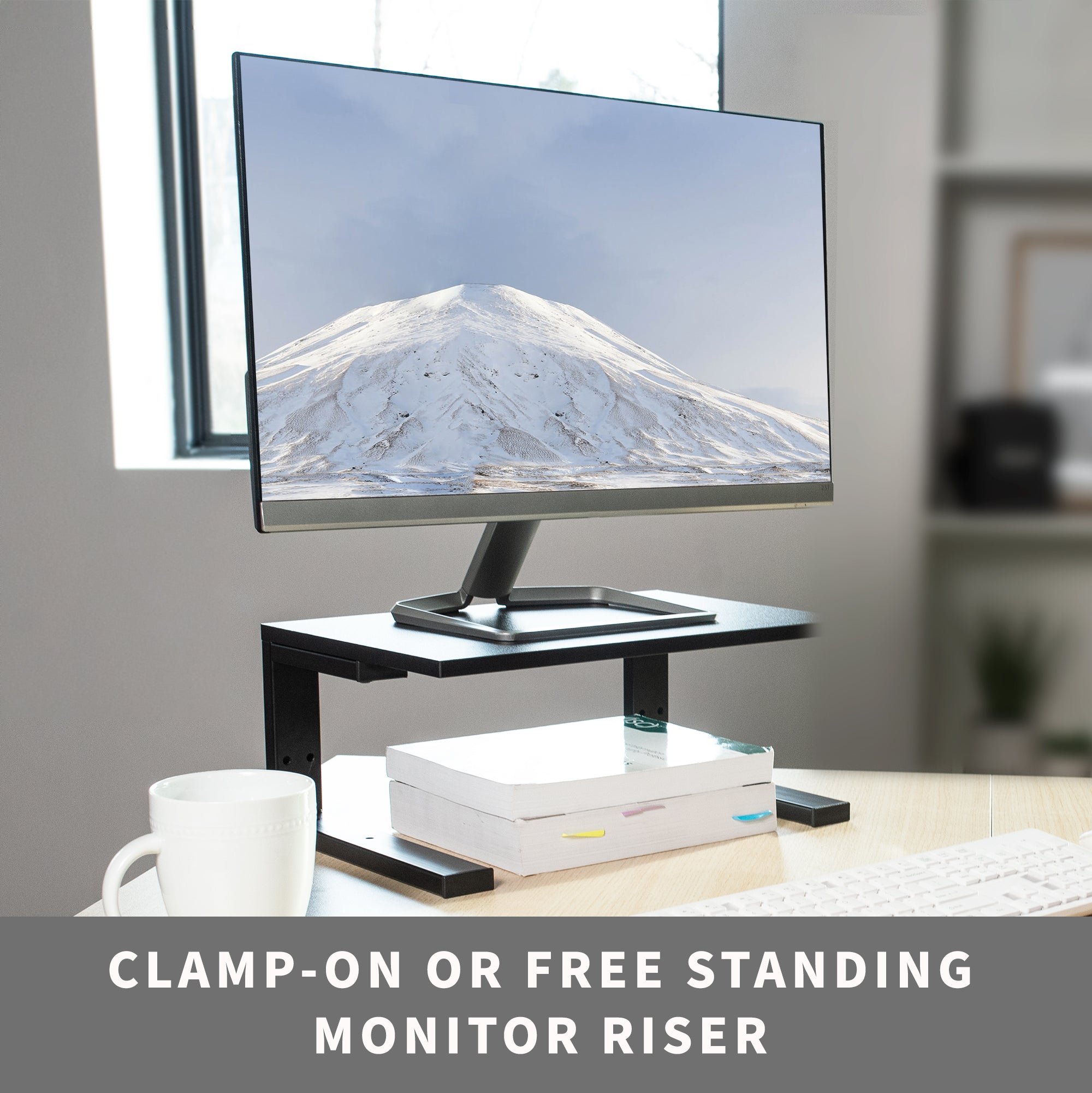  A clamp on a desk shelf is being used as a free-standing monitor riser.