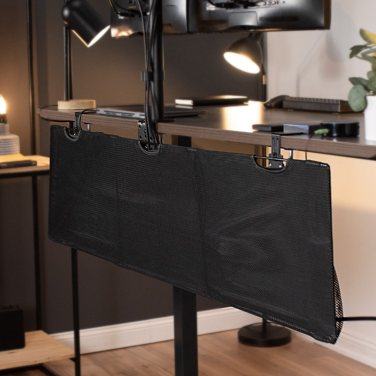 Durable clamp-on desk skirt with pockets for extra storage.