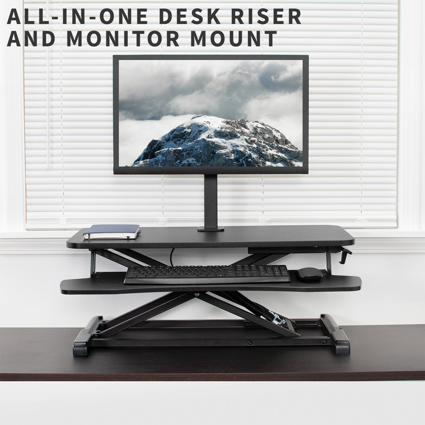 Keyboard tray and monitor mount desk riser that will transform your workspace from sitting to standing at the touch of a hand.