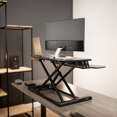 Sturdy height adjustable 2-tiered desk riser for ergonomic office workstation.