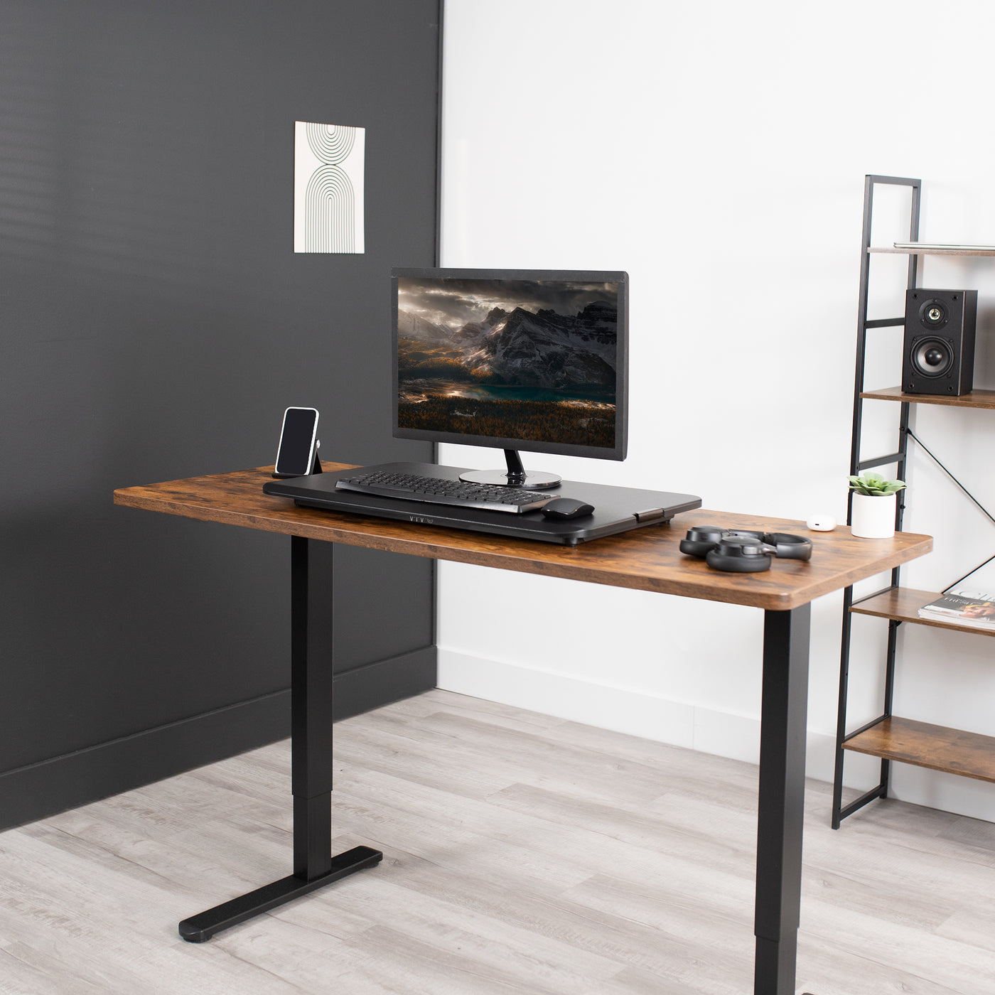 Sit at a desk with a tabletop desk converter.
