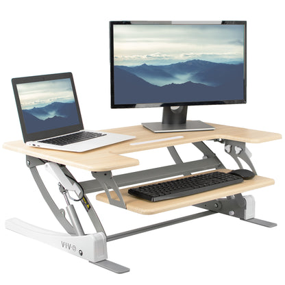 Heavy-duty height adjustable desk converter monitor riser with 2 tiers.