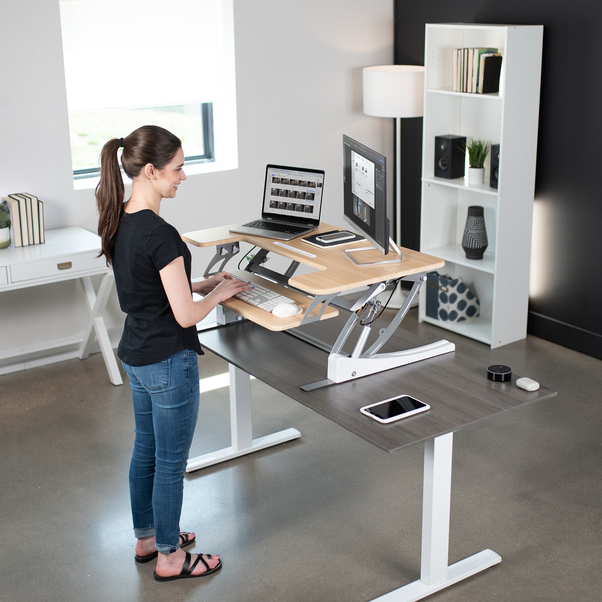 Heavy-duty height adjustable desk converter monitor riser with 2 tiers.