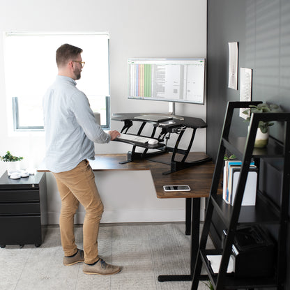 Heavy-duty height adjustable corner desk converter monitor riser with 2 tiers.