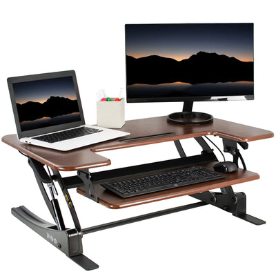 Heavy-duty height adjustable desk converter monitor riser with 2 tiers.
