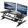 Electric desk converter monitor riser supporting two monitors with a USB port.