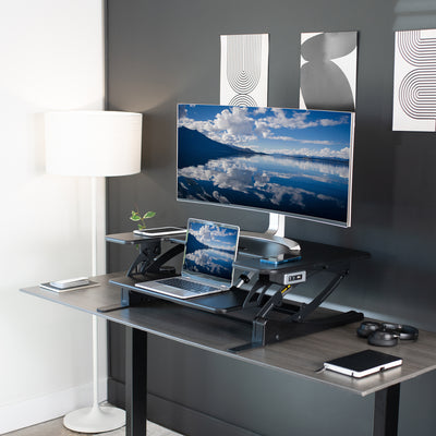Modern furbished workspace with desk converter from VIVO.