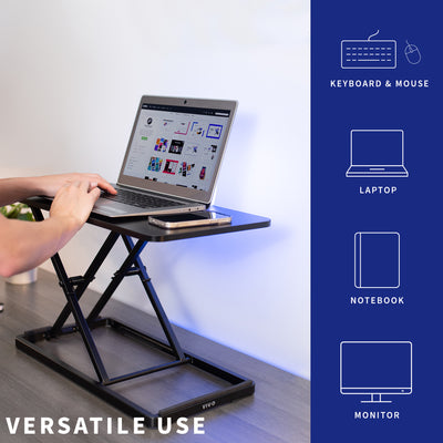 Versatile height adjustable desk converter keyboard riser.