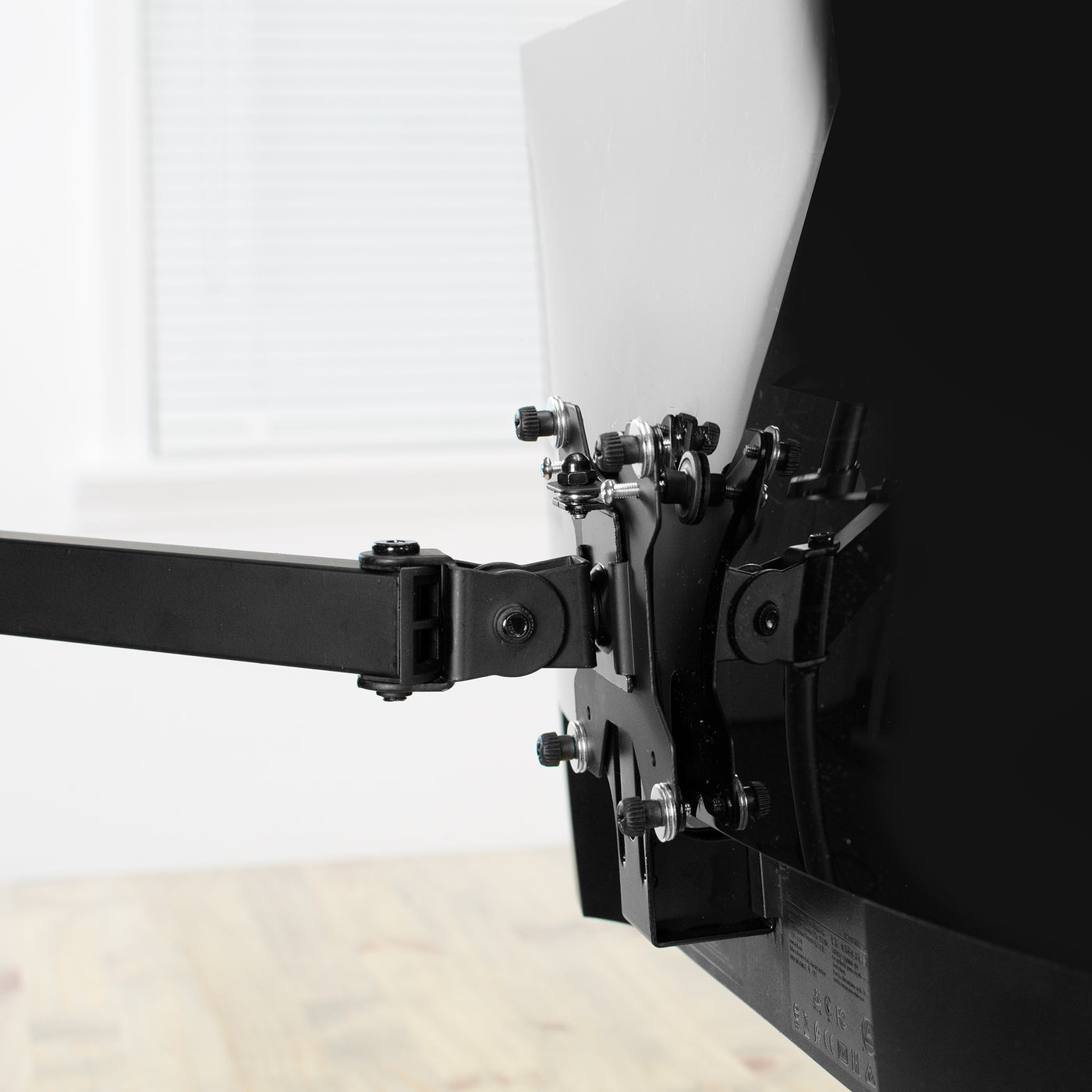 Electric sit-to-stand desk frame from VIVO with the mounted monitor.