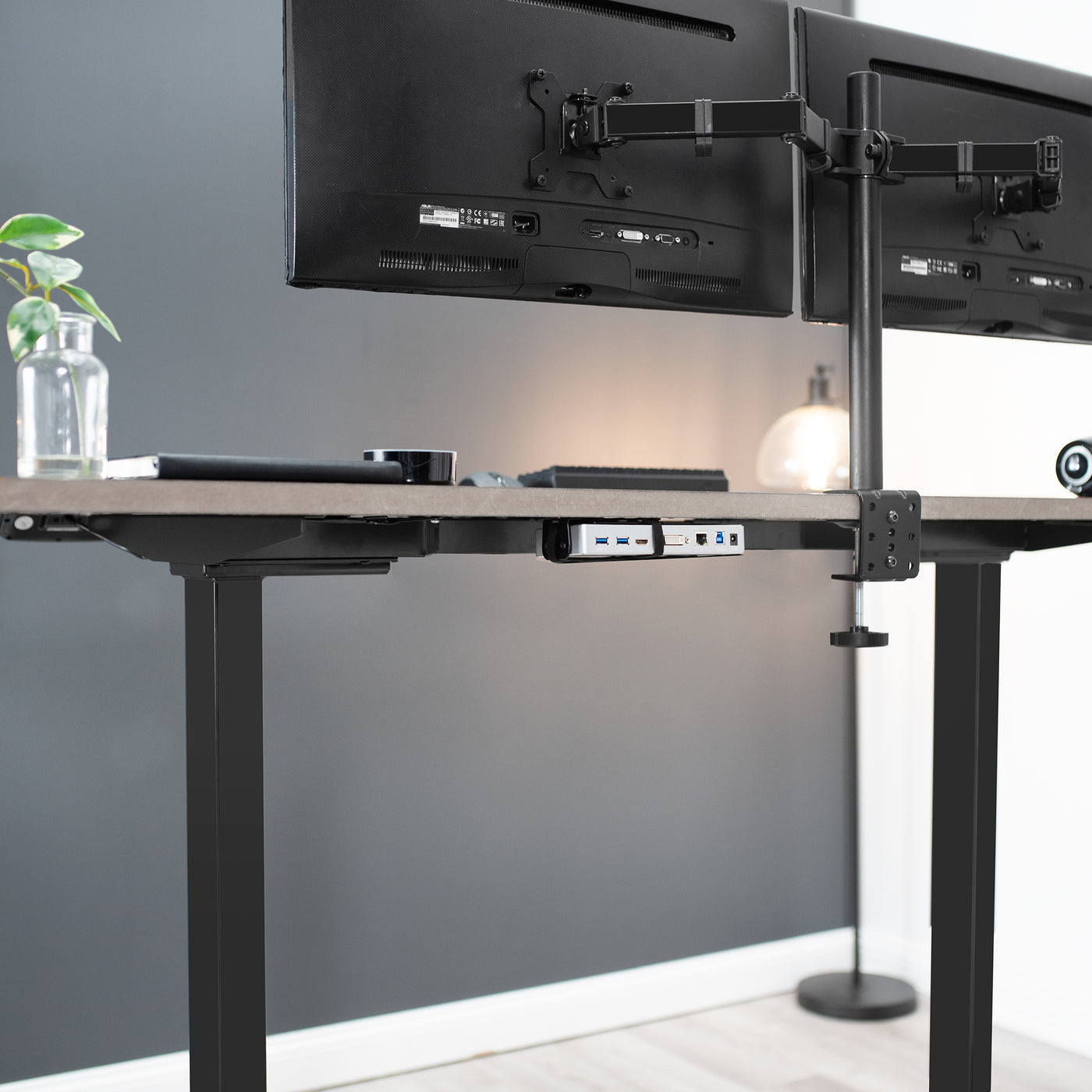 Reduce desk clutter and maintain a low profile set up with a back of monitor clamp on the docking station.