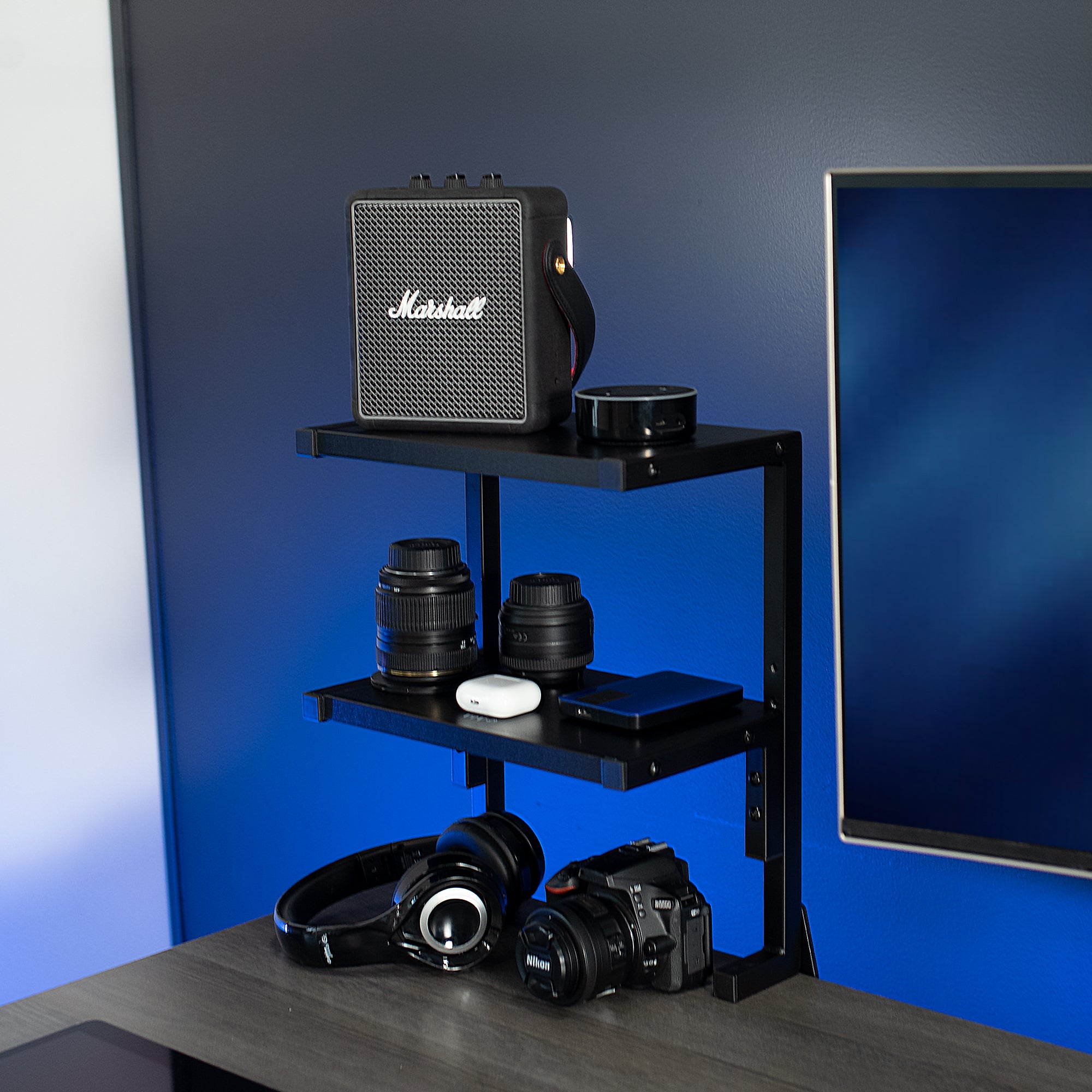 Sleek above desk or below desk clamp-on shelf with two shelves for convenient storage and organization. Lower shelf height adjusts and is removable.