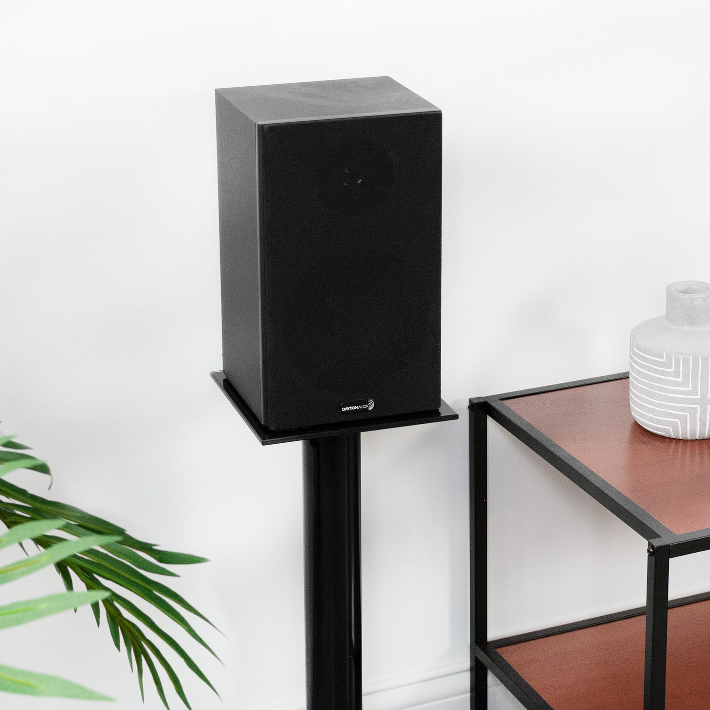 Heavy-duty speaker stands for surround sound speakers.