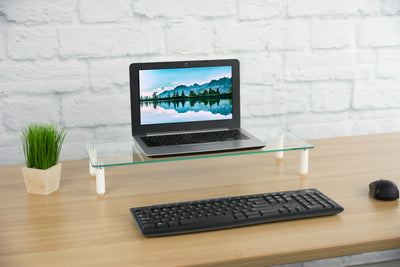 Sturdy glass tabletop monitor riser for comfortable viewing.
