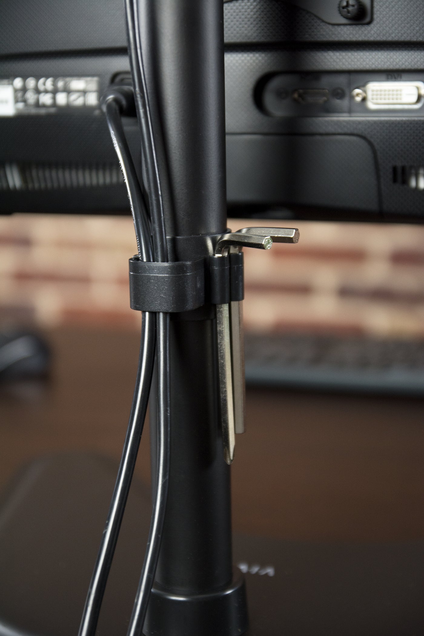 Sturdy adjustable vertical dual monitor ergonomic desk stand for office workstation.
