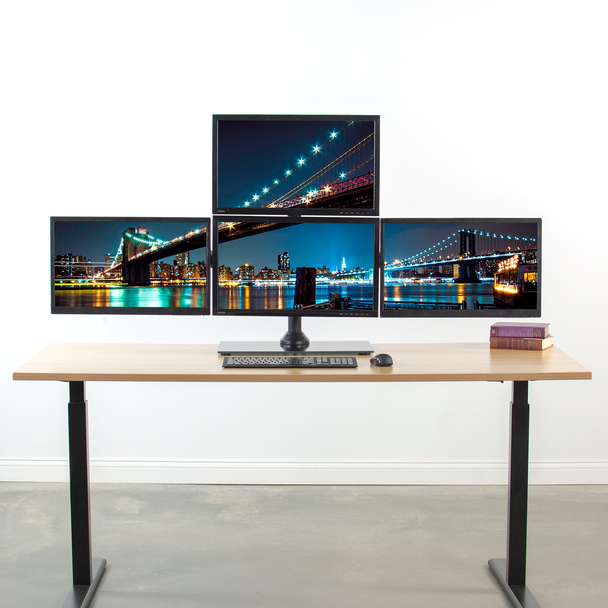 Sturdy height adjustable quad monitor desk stand.