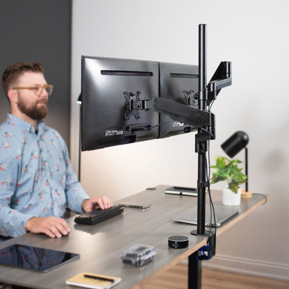 Sturdy pneumatic arm dual monitor extra tall desk mount.