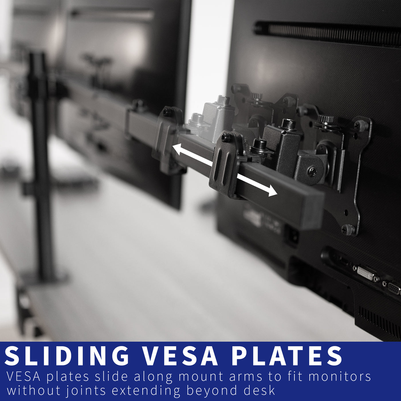 Sturdy flush to wall height adjustable triple monitor desk mount with sliding VESA plates.